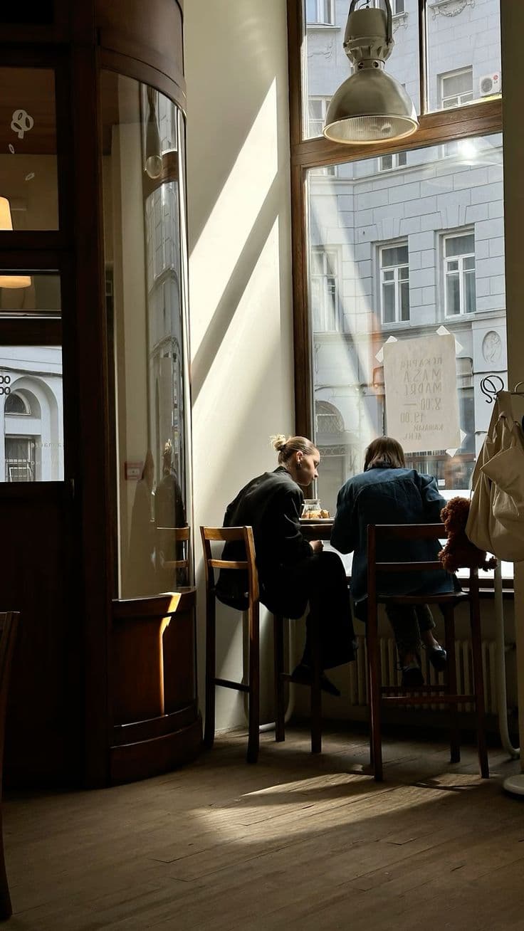People sitting in a warmly lit coffee shop